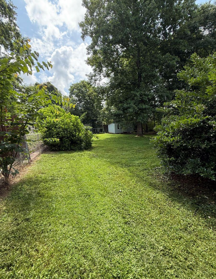 Freshly mowed backyard after GreenShine Outdoors lawn service